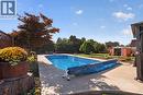 Photos of the pool and backyard have been digitally altered to show the anticipated finished appearance. The pool liner is currently being replaced and the grass has been reseeded. - 1261 Lawson Avenue, Kelowna, BC 