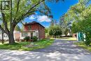 Brick and siding exterior with a pitched roof, front entry porch, and mature trees - 781 Oakdale Avenue, Burlington, ON 