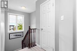 Hallway and stairs to second level - 