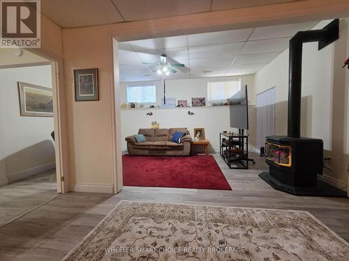 An L-shaped family room in the basement - 78 Maple Street, South Stormont, ON 