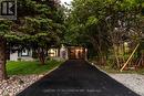 Front at dusk, tree-lined drive, parking for six - 139 Town Line, Orangeville, ON 