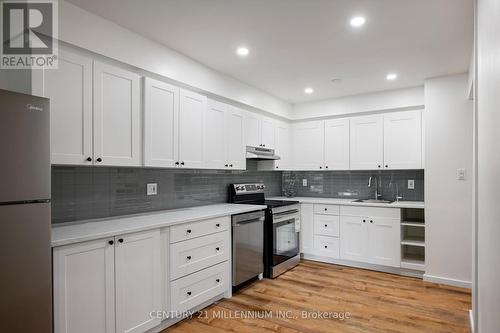 Kitchen: shaker cabinets, stainless appliances - 139 Town Line, Orangeville, ON 