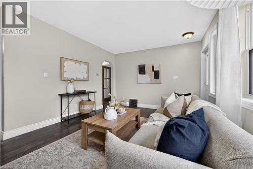Recessed lighting, wood-finish flooring, archway entry, multi-pane windows, and a ceiling-mounted light fixture - 176 Avalon Place, Kitchener, ON 