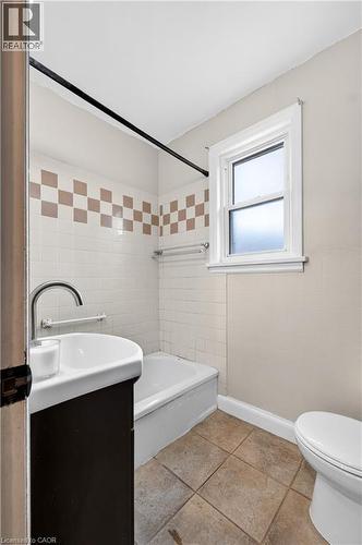 White tiled shower surround with accent band - 176 Avalon Place, Kitchener, ON 