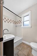 White tiled shower surround with accent band - 