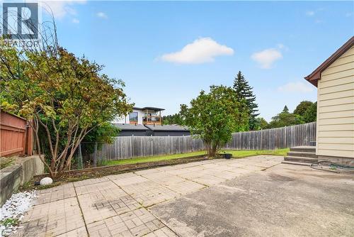 Expansive paved patio area featuring a concrete block design and a separate concrete slab - 176 Avalon Place, Kitchener, ON 
