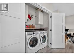 Convenient upstairs laundry located on the same floor as all three bedrooms, with built-in storage and hanging space - 