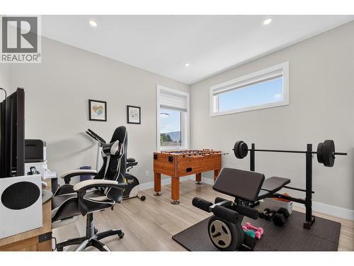 Versatile upstairs bonus space — perfect for a home office, playroom, gym or second living area - 2400 Hawks Boulevard, West Kelowna, BC 