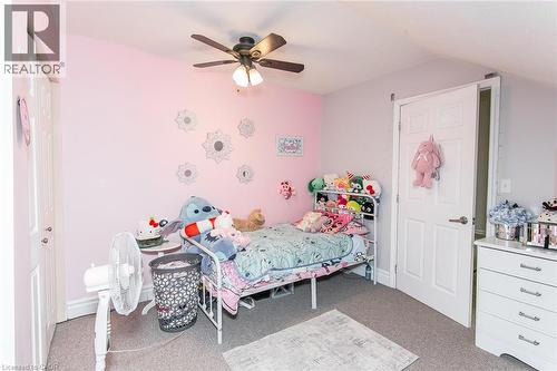 Carpeted flooring, paneled interior doors, and a ceiling fan with integrated lighting - 393 Huron Street, New Hamburg, ON 