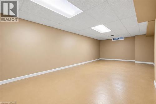 Expansive room featuring neutral wall tones and a drop ceiling with recessed lighting - 5 Michelle Drive, St. Catharines, ON 