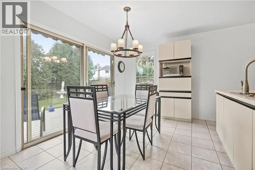 Sliding glass doors provide access to an outdoor deck - 5 Michelle Drive, St. Catharines, ON 