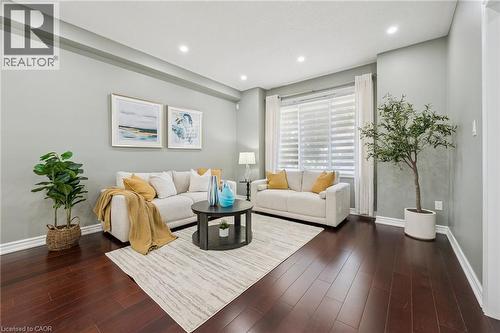 Recessed lighting illuminates wood-finish flooring - 154 Falconridge Drive, Kitchener, ON 