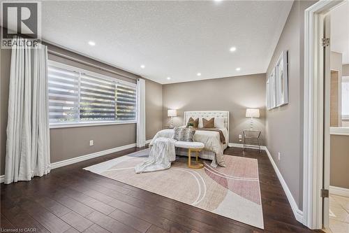 Recessed lighting throughout, wood-finish flooring, and multiple windows with custom blinds - 154 Falconridge Drive, Kitchener, ON 