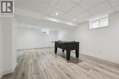 Recessed lighting, drop ceiling, light wood-finish flooring, and white walls - 154 Falconridge Drive, Kitchener, ON 