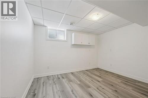 White walls with wood-finish flooring - 154 Falconridge Drive, Kitchener, ON 