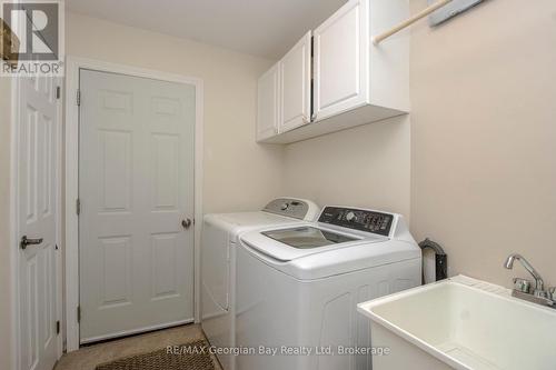 main floor laundry- garage access - 68 Riverwalk Place, Midland, ON 