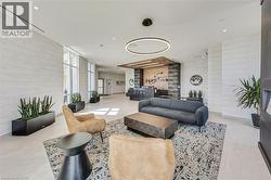 Lobby featuring large-format tile flooring and extensive window lines - 