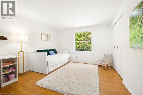 Wood-finish flooring with white walls and a single window - 351 Craigleith Drive, Waterloo, ON 