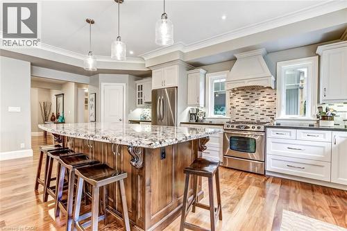 Modern lighting, stainless steel appliances, engineered hardwood, granite countertops, backsplash and so much more. - 59 Decou Road, Simcoe, ON 