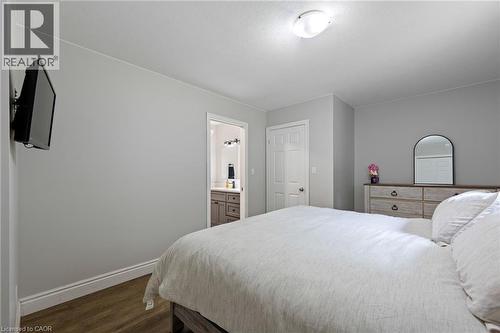 Recessed lighting, wood-finish flooring, and a white interior door - 53 Hawtrey Road, Delhi, ON 