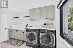Laundry upstairs with a sink and a view - 