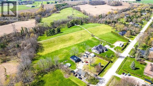 Expansive green space with manicured lawns and mature trees - 47 River Road, Brantford, ON 