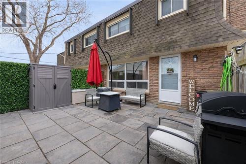 View of patio with a storage shed - 5 Viking Court Unit# 301, Grimsby, ON 