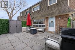 View of patio with a storage shed - 
