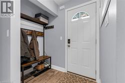 Mudroom featuring baseboards and light wood finished floors - 
