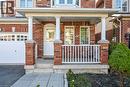 Brick facade with a covered porch, white columns, and a railing - 103 Emick Drive, Ancaster, ON 