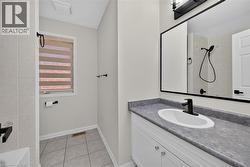 White vanity with gray countertop and integrated sink - 