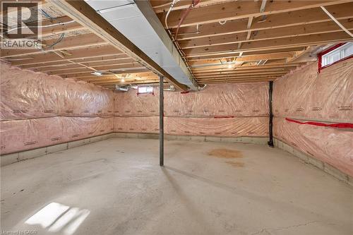 Unfinished basement with concrete flooring and exposed joists - 103 Emick Drive, Ancaster, ON 