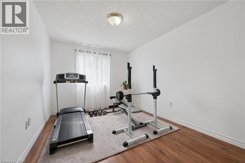 Wood-finish flooring and white walls - 54 Green Valley Drive Unit# 13, Kitchener, ON 