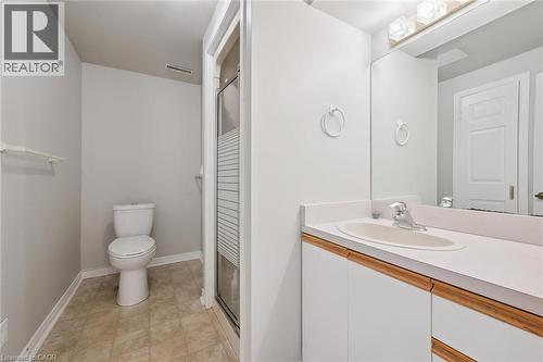 White vanity with an integrated sink and laminate countertop - 512 Thorndale Drive, Waterloo, ON 