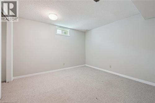 Carpeted flooring, neutral wall color, and a window for natural light - 512 Thorndale Drive, Waterloo, ON 