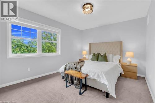 Dual window with white trim, wall-to-wall carpeting, and flush mount ceiling light - 2435 Coho Way, Oakville, ON 