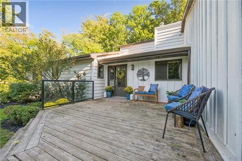 Expansive wooden deck with glass panel railing - 282 Concession Rd 2, Scotland, ON 