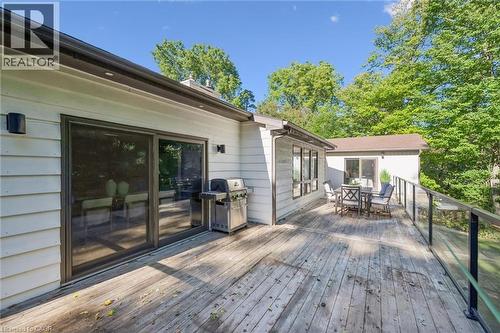 Expansive outdoor wood deck with glass panel railings - 282 Concession Rd 2, Scotland, ON 