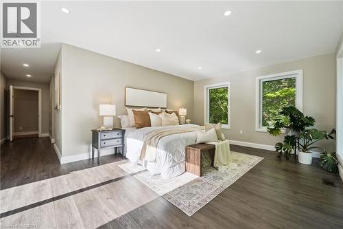 Recessed lighting, wood-finish flooring, two large windows, white trim, and light neutral wall paint - 282 Concession Rd 2, Scotland, ON 