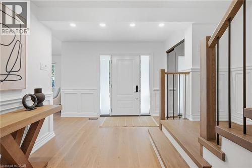 Entryway featuring wood-finish flooring, recessed lighting, and wainscoting - 4159 Spruce Avenue, Burlington, ON 
