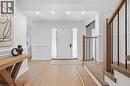 Entryway featuring wood-finish flooring, recessed lighting, and wainscoting - 4159 Spruce Avenue, Burlington, ON 