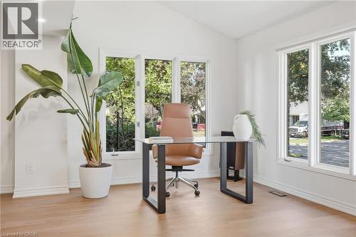 Vaulted ceiling with recessed lighting, wood-finish flooring, and multiple large windows - 4159 Spruce Avenue, Burlington, ON 
