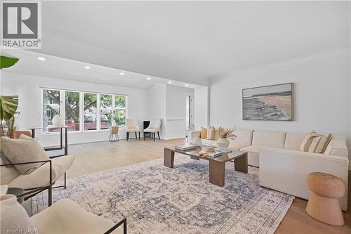Recessed lighting, wood-finish flooring, white painted walls, large picture windows, and vaulted ceilings - 4159 Spruce Avenue, Burlington, ON 