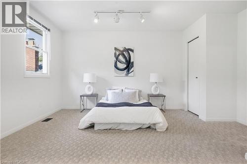 Recessed window with white trim, track lighting, and soft carpet flooring - 4159 Spruce Avenue, Burlington, ON 