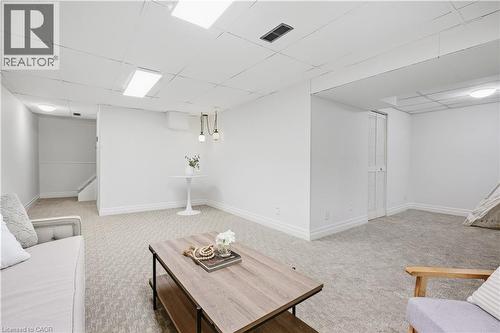 Finished lower level featuring recessed lighting, drop ceiling, and wall-to-wall carpeting - 4159 Spruce Avenue, Burlington, ON 