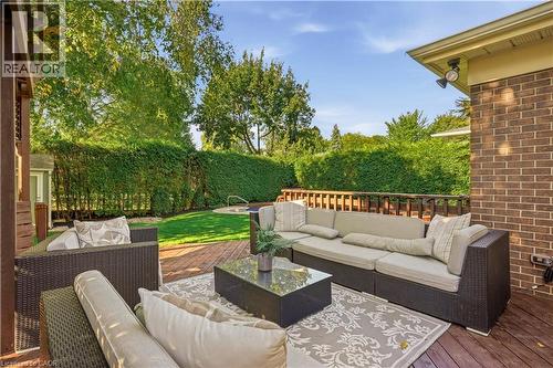 Expansive wood deck with brick wall detailing - 4159 Spruce Avenue, Burlington, ON 