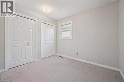 Neutral-toned walls complement light-colored carpeting - 