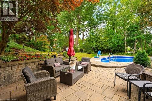 Outdoor patio space with picturesque landscaping - 200 Woodview Crescent, Ancaster, ON 