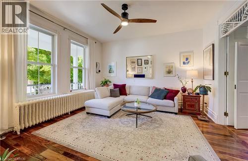 Hardwood flooring, painted white walls, and a ceiling fan - 59 Allen Street W, Waterloo, ON 