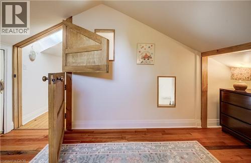 Wood-finish flooring with a sloped ceiling - 59 Allen Street W, Waterloo, ON 